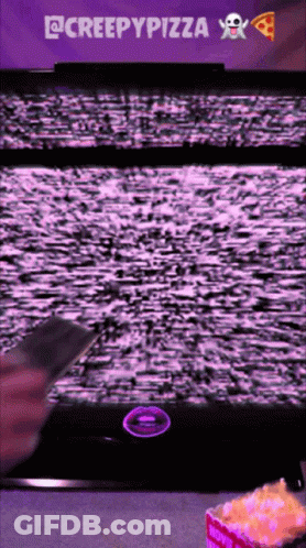 Person Holding Remote Control To TV Saying Creepypizza GIF