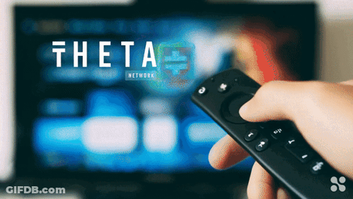 Person Holding Remote In Front Of TV Saying Theta Network GIF