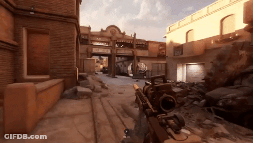 Person Holding Rifle In Front Of Building Number 25 GIF