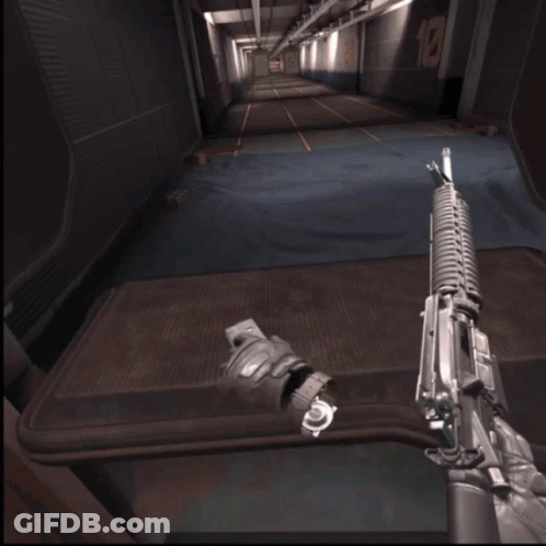 Person Holding Rifle In Hallway With E1 Sign GIF