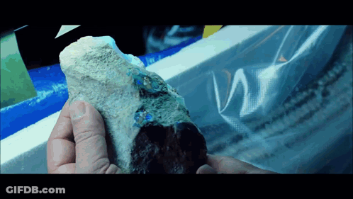 Person Holding Rock With Plastic Bag GIF