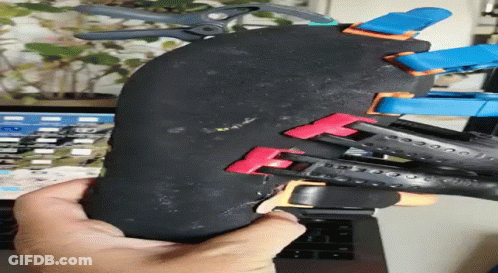 Person Holding Rubber With Clamps GIF