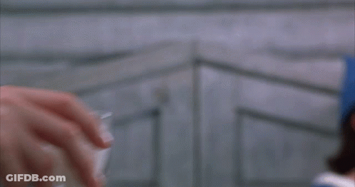 Person Holding Shot Glass With Foam GIF