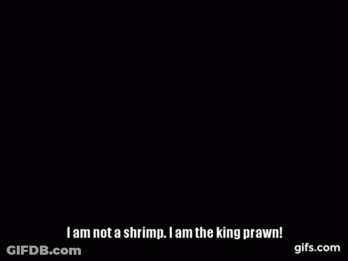 Person Holding Shrimp In Front Of Pepe Sign GIF