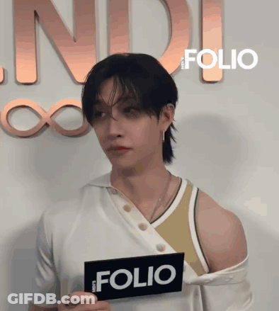 Person Holding Sign Saying Folio GIF