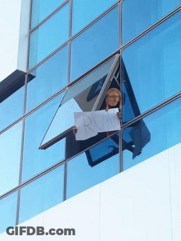 Person Holding Sign Saying Run GIF