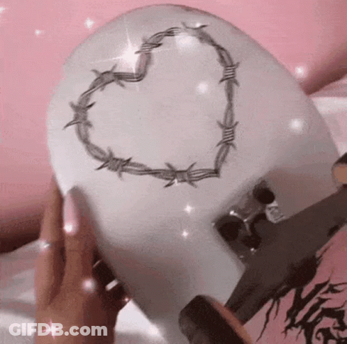 Person Holding Skateboard With Heart Of Barbed Wire GIF