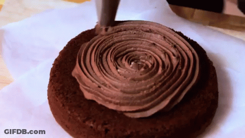 Person Holding Slice Of Cornbread With Witches GIF