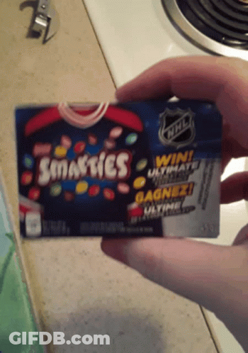 Person Holding Smarties Candy GIF