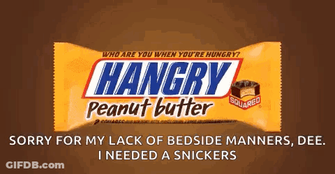 Person Holding Snickers Bar In Front Of Computer GIF