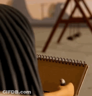 Person Holding Spiral Notebook And Pen GIF