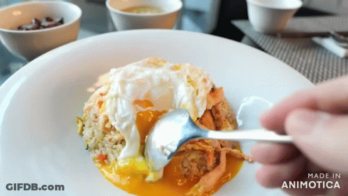 Person Holding Spoon Over Plate Of Food Made In Animatica GIF