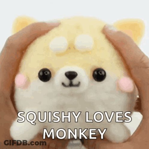 Person Holding Squishy Loves Monkey Stuffed Animal GIF