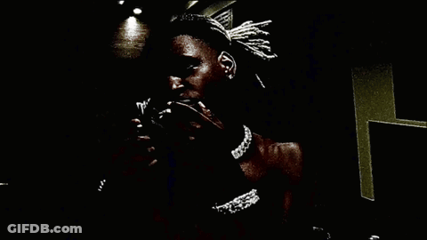 Person Holding Stack Of Money In Dark Room GIF