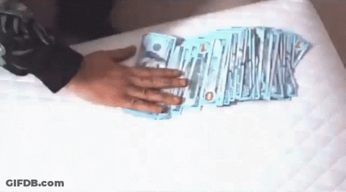 Person Holding Stack Of Money With 10 GIF