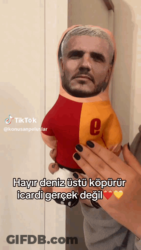 Person Holding Stuffed Doll With Man's Face GIF