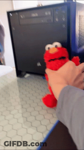 Person Holding Stuffed Elmo GIF