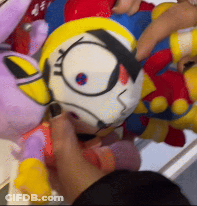 Person Holding Stuffed Robot GIF