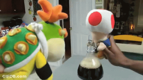 Person Holding Stuffed Toad With Red Spot GIF