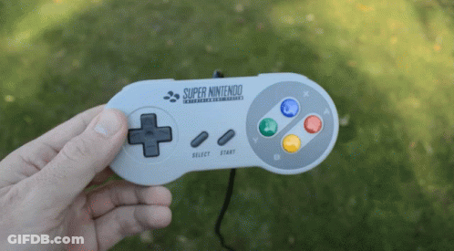 Person Holding Super Nintendo Controller GIF