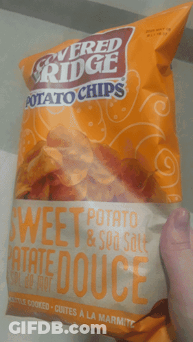 Person Holding Sweet Potato Chips GIF