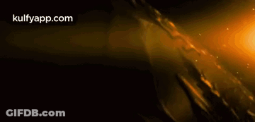Person Holding Sword In Dark Room GIF