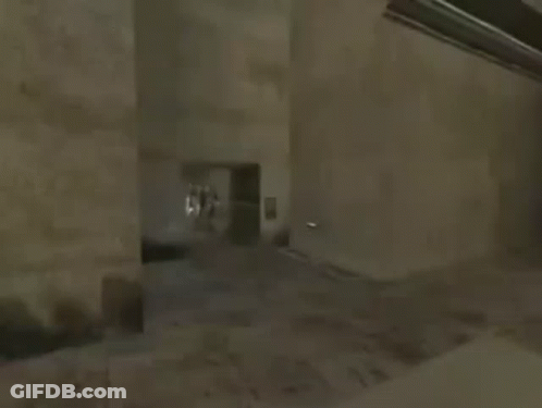 Person Holding Sword Next To Building GIF