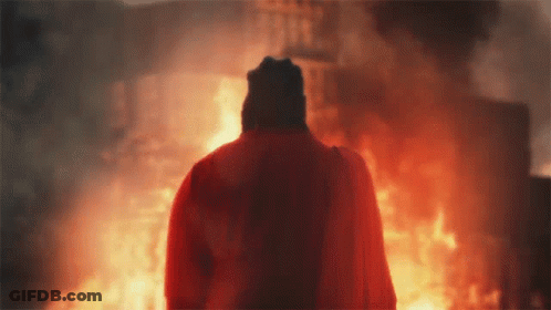 Person Holding Sword With Lightning Behind GIF