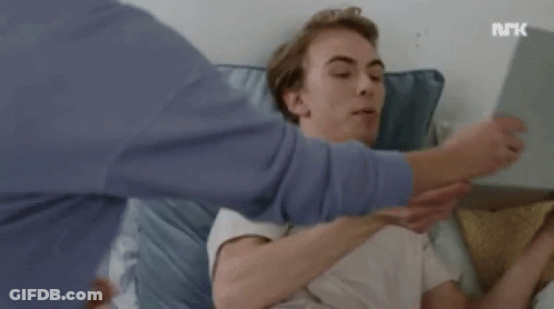Person Holding Tablet In Front Of Face And Laptop GIF