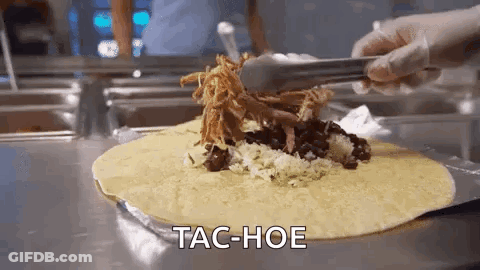 Person Holding Tongs Over Tac-Hoe Tortilla GIF