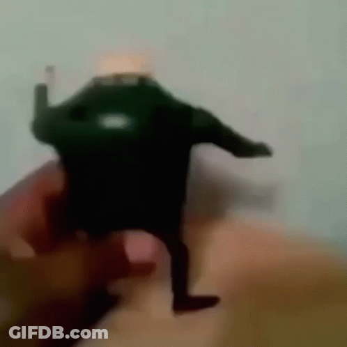 Person Holding Toy Figure GIF