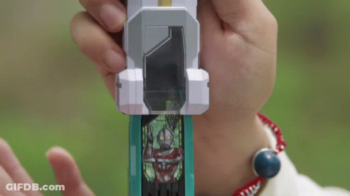 Person Holding Toy In Hands And Looking At It GIF