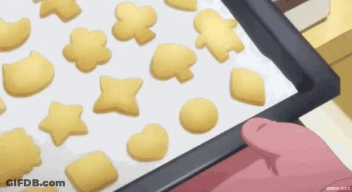 Person Holding Tray Of Cookies GIF