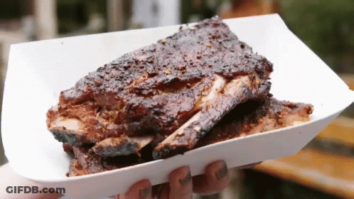 Person Holding Tray Of Ribs GIF