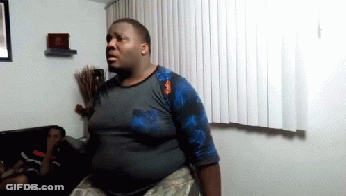 Person Holding Two Boxes Of King's Bridges And Raptor Rush GIF