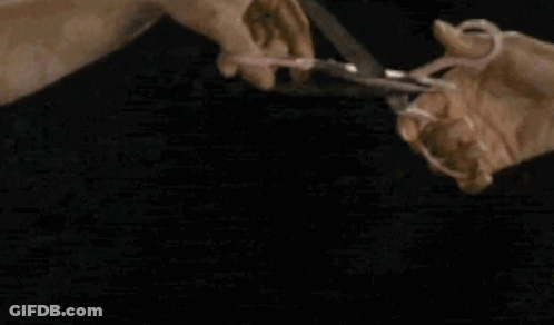 Person Holding Two Tacos Eating GIF