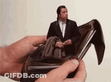 Person Holding Wallet With Man Sitting Inside GIF