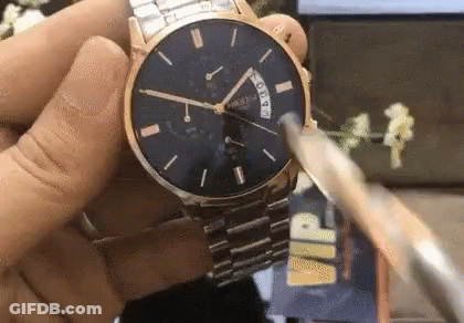 Person Holding Watch With VIP Text GIF