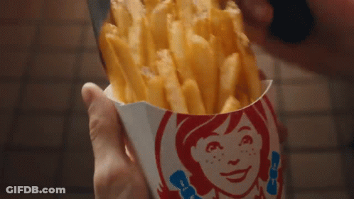 Person Holding Wendy's Fries Container GIF