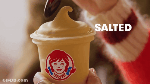 Person Holding Wendy's Ice Cream With Spoon GIF