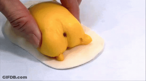 Person Holding Yellow Chicken Butt Object GIF