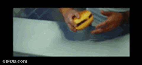 Person Holding Yellow Object GIF