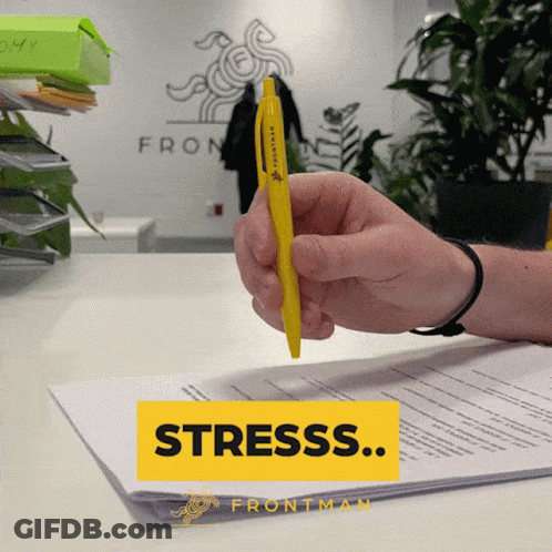 Person Holding Yellow Pen And Yellow Stress Box GIF