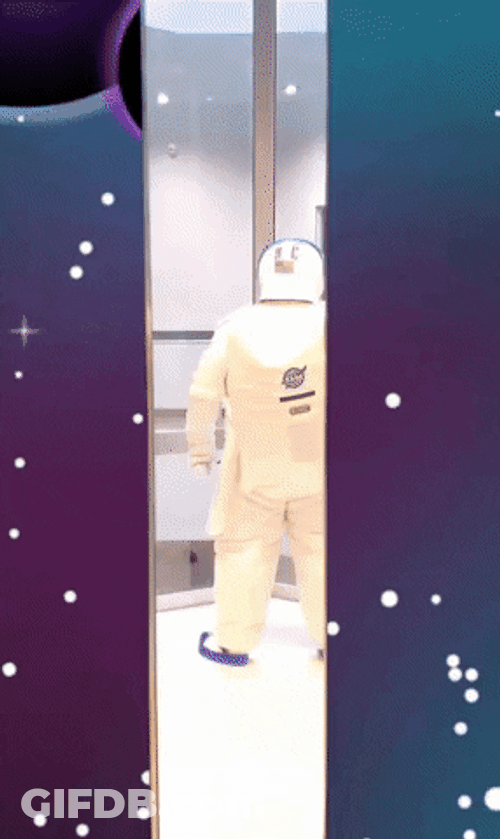 Person In Astronaut Suit Getting Off Elevator GIF