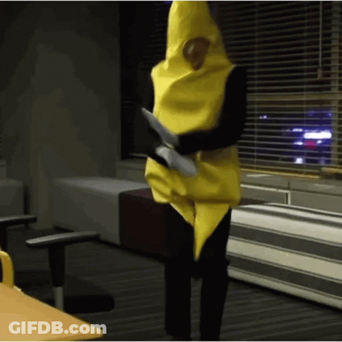 Person In Banana Costume Standing At Window GIF