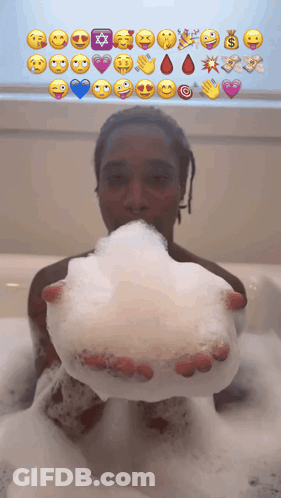 Person In Bathtub Holding Soap Bubble With Emoji Faces GIF