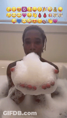 Person In Bathtub Holding Soap Bubble With Emojis GIF