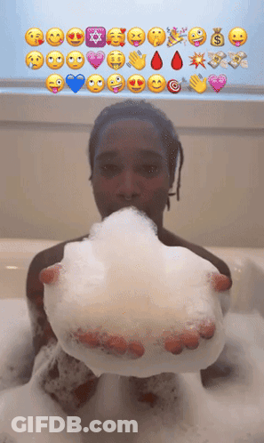 Person In Bathtub Holding Soap Bubble With Emojis GIF