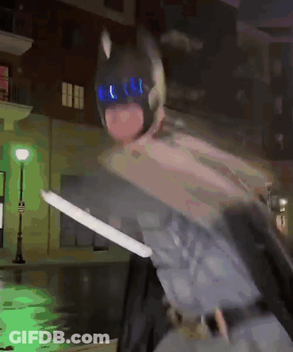 Person In Batman Costume Holding Sword GIF