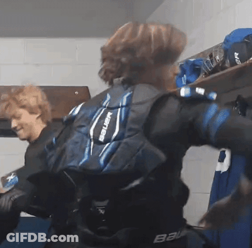 Person In Bauer Shoulder Pads In Locker Room GIF